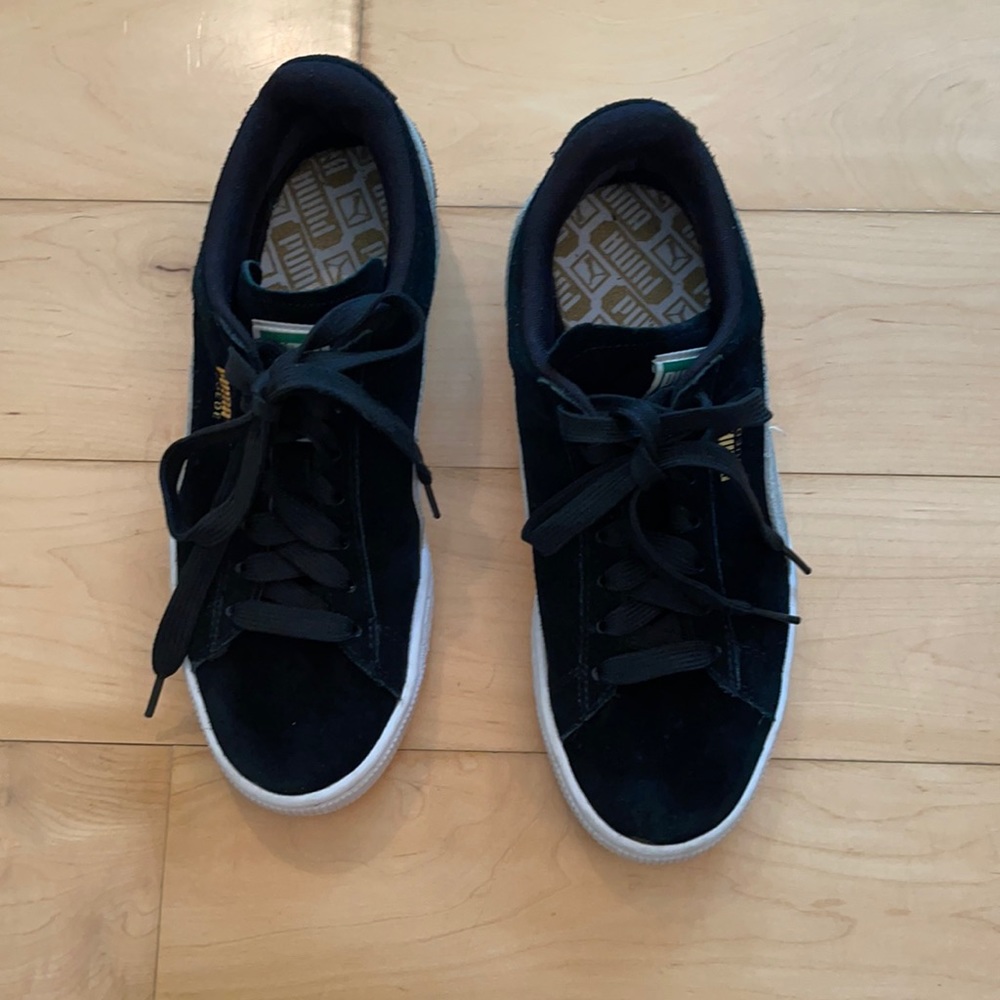 Black suede Puma sneakers